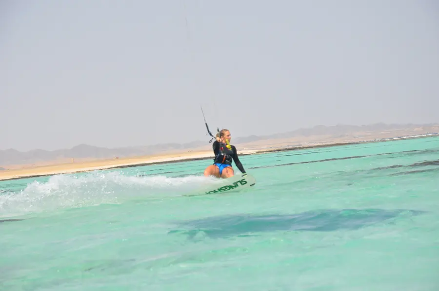 Kitesurfer riding in the shallow, glassy lagoon at Marsa Alam